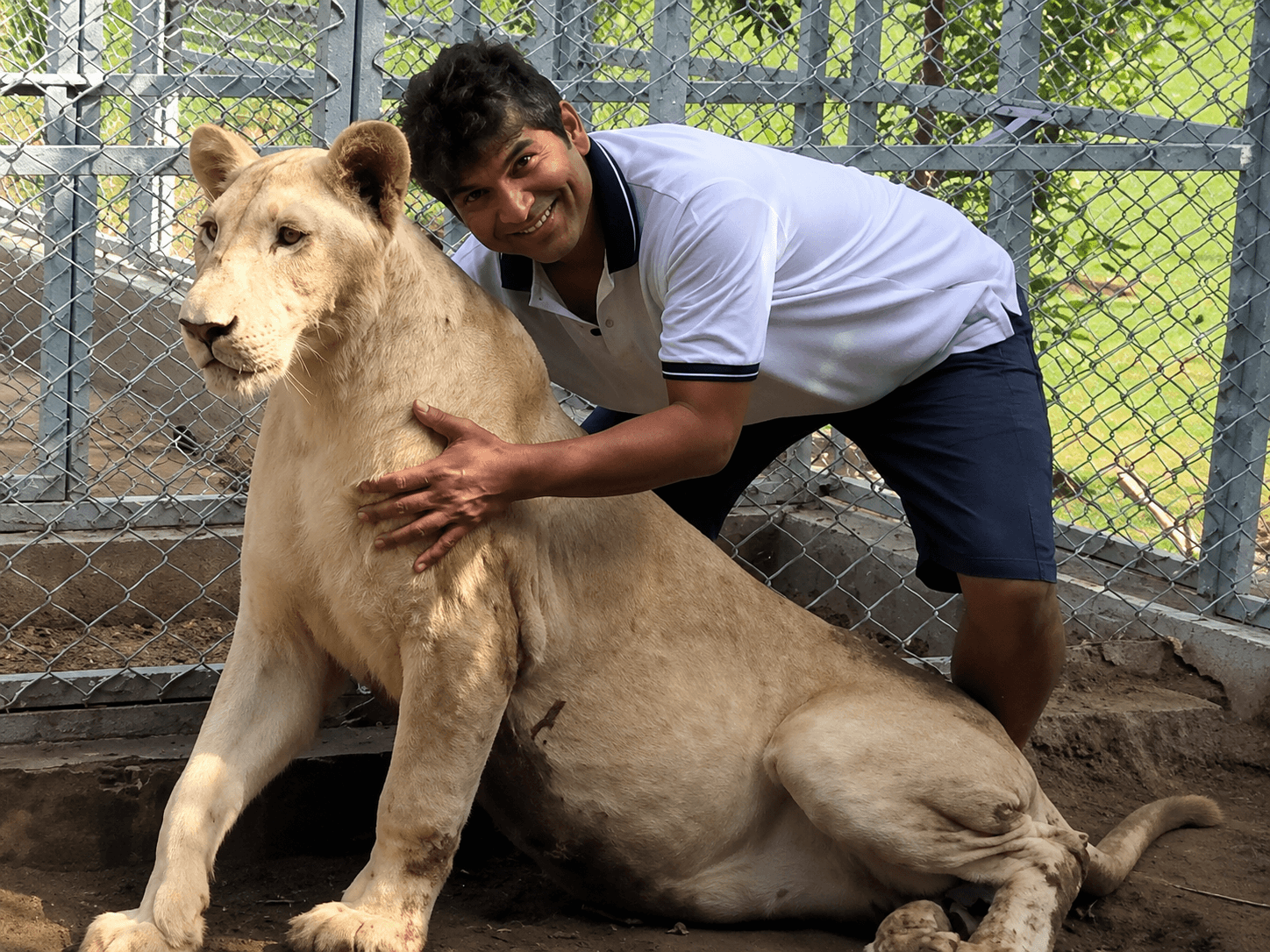 A bold personal moment with the family's pet lion.