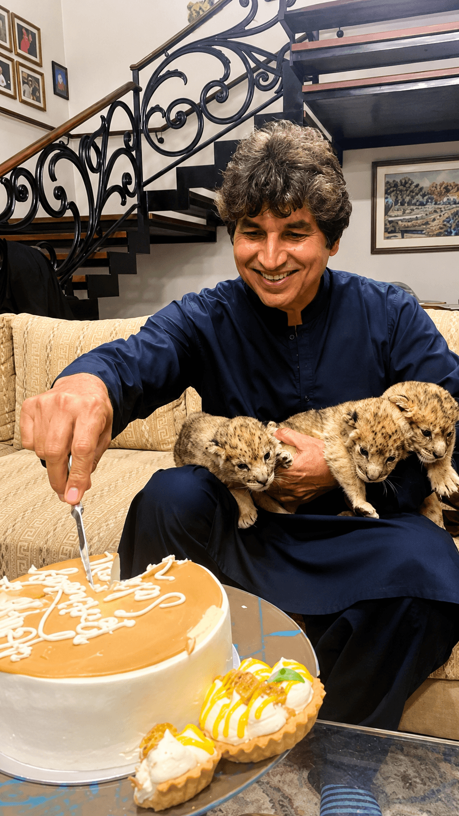 Celebrating new life while cutting cake with newborn cubs.